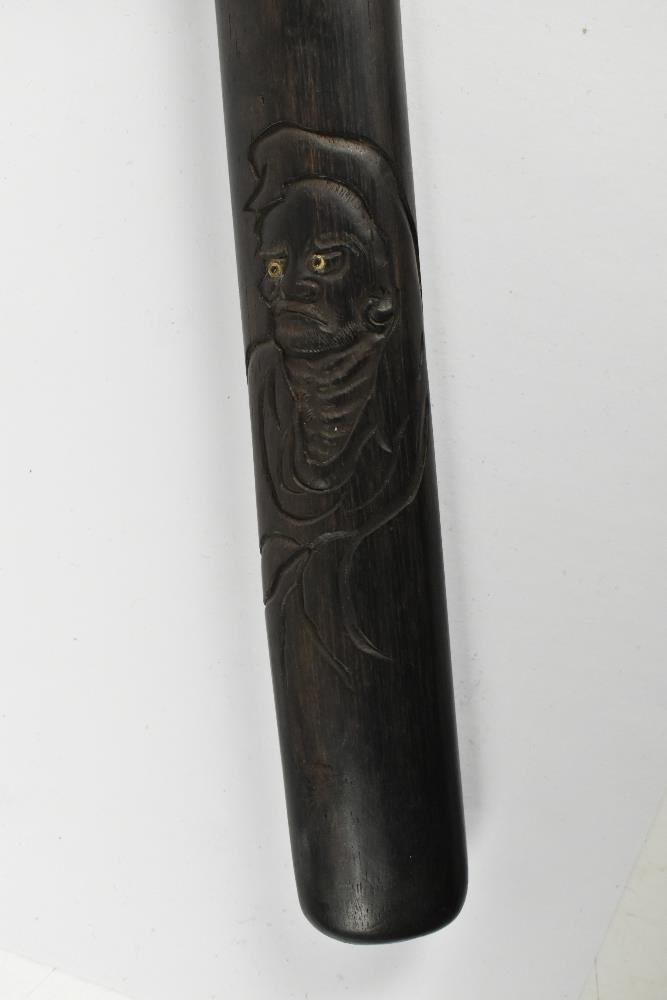 A good Japanese Meiji period hardwood doctor's accutchi with carved detail featuring ascetic monk, - Image 2 of 6