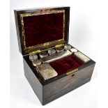 A Victorian coromandel rectangular dressing box with vacant mother of pearl cartouche with hinged