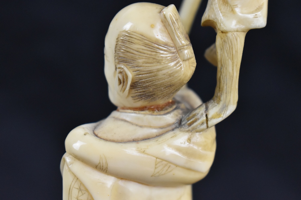 Two Japanese Meiji period carved ivory okimonos, the larger a group featuring man, child and monkey, - Image 4 of 5