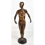 A mid-20th century bronzed sculpture of a nude male raised on circular plinth base, height 52cm,