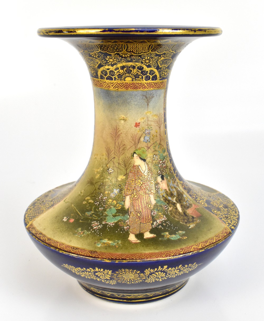 A Japanese Satsuma vase of waisted form with flared rim, the body decorated with two panels of