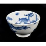 A Chinese blue and white porcelain tea bowl decorated with a four claw dragon, unmarked, height 4.
