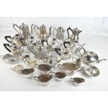 A group of silver plated tea ware to include a Walker & Hall three piece part gadrooned tea set,