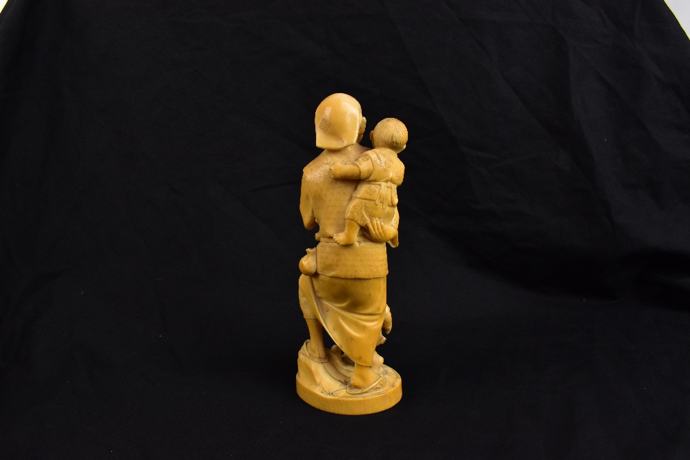 TOKYO SCHOOL; a good Japanese Meiji period carved ivory okimono modelled as a man holding a crab - Image 3 of 5