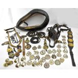 A leather horse collar, a pair of brass hames and a quantity of horse brasses, some mounted on