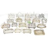 A group of eighteen silver plated toast racks to include a Walker & Hall oval example, etc.