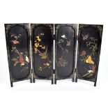 A 1920s Chinese black lacquered and hardstone inset three fold four panel table screen, height 37.