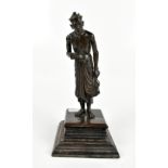 A Japanese Meiji period bronze figure of an ascetic monk on stained stepped wooden base, height 21.