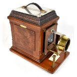 J LANCASTER & SON OF BIRMINGHAM; a late 19th century mahogany cased magic lantern, with stamped