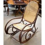 A reproduction bentwood rocking chair.
