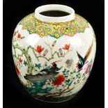 A late 19th century Chinese Famille Verte vase of bulbous form, painted with stylised birds in