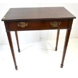 An early 19th century mahogany side table with single frieze drawer, raised on tapering supports,