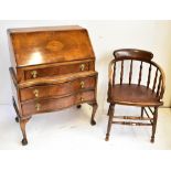 An early 20th century walnut bureau, the fall front enclosing fitted interior above three drawers on