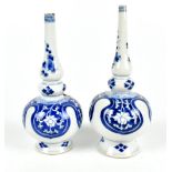 Two 18th century Chinese porcelain triple gourd blue and white vases, painted with floral sprays