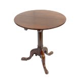 A George III mahogany tilt top occasional table with birdcage action, the hinged top above barrel