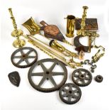 A group of brassware including fire tools, candelsticks, etc and further metalware.