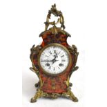 A 19th century French Boulle work mantel clock with applied gilt metal detail, the circular enamel