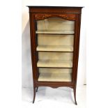 An Edwardian mahogany inlaid and boxwood strung single door display cabinet raised on splayed square