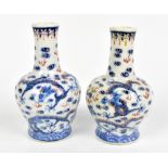 A pair of early 20th century Chinese miniature vases, painted with five claw dragons amongst clouds,