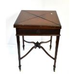 An Edwardian mahogany envelope top card table with frieze drawer raised on square tapering