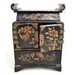 An early to mid-20th century Japanese lacquered jewellery cabinet with an arrangement of two drawers