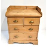 A stripped pine wash stand with two short over two long drawers raised on plinth base, height