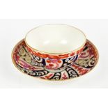 WORCESTER; an 18th century tea bowl and saucer painted in the 'Queen Charlotte' pattern, circa 1775,