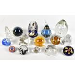 A group of glass paperweights including single Mdina and two Caithness examples, also three