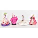 ROYAL DOULTON; four figures, 'Delight' HN1772, 'Janet' HN1537, 'Easter Day' HN2039, and '