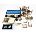 A group of electroplated items, including cased and loose flatware, horn handled teapot and milk