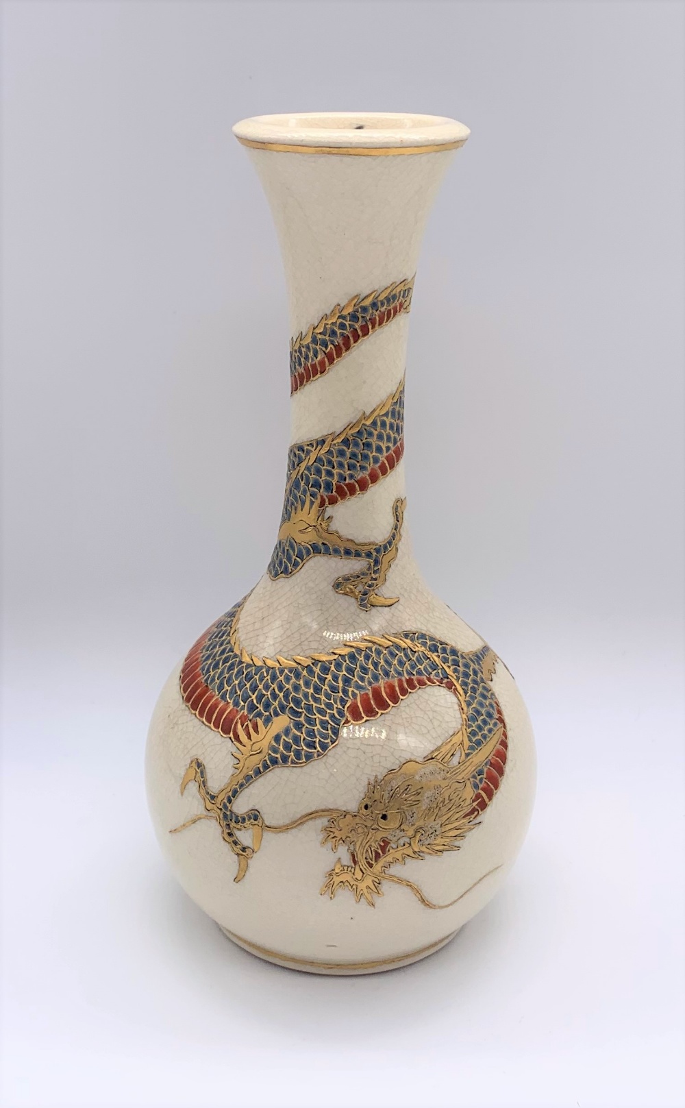 A Japanese Meiji period Satsuma vase decorated with a single dragon on a cream ground, unsigned,