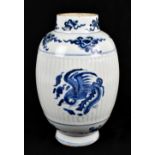 An 18th century Chinese porcelain blue and white vase, painted with phoenix on a ribbed body, the