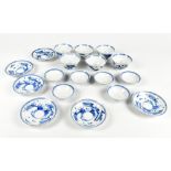 A Japanese blue and white porcelain six setting tea bowl, saucer and cover service, painted with