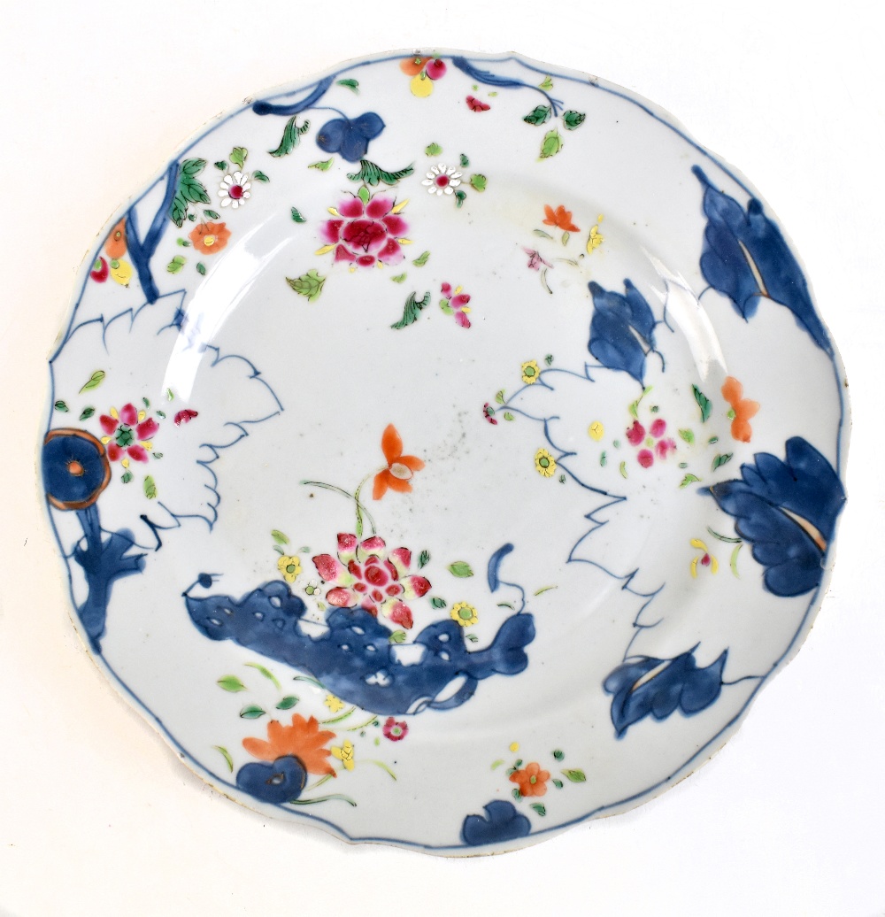 An 18th century Chinese porcelain unfinished Tobacco Leaf pattern plate with enamelled detail and