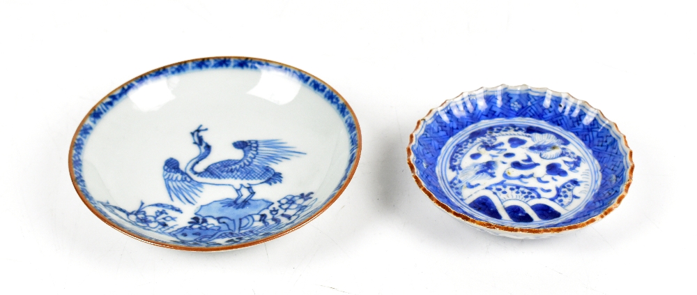 A Chinese blue and white porcelain saucer decorated with a crane swallowing a fish, diameter 11.