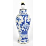 An early 20th century Chinese blue and white porcelain vase converted to a lamp base painted with