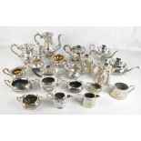 A group of silver plated tea ware to include a squat three piece tea set with cast floral detail,