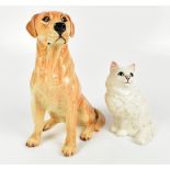 BESWICK; a fireside model of a Labrador, no.2314, height 34cm, and a model of a cat, no.1867 (2).