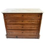 A mid to late 19th century French walnut four drawer commode, the shaped veined white marble top