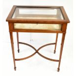 An Edwardian mahogany satinwood banded and boxwood lined inlaid bijouterie cabinet, the glazed upper