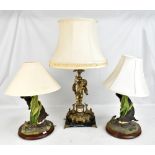 A decorative brass table lamp modelled as a cherub on marble base, height to fitment approx 46cm,