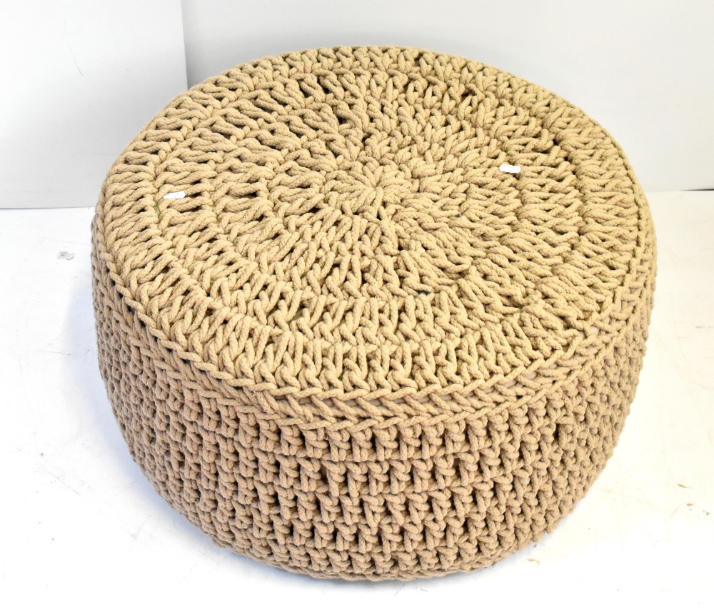 A modern string tied pouffe, diameter 65cm. Additional InformationBasically in good condition.