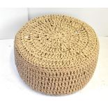 A modern string tied pouffe, diameter 65cm. Additional InformationBasically in good condition.