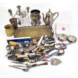 A group of silver plated items including bottle coasters, teapot, candelabrum, purse, collared