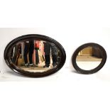 Two early 20th century wall mirrors, the oval example with bevelled glass, 85 x 63cm (2).