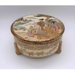 A Japanese Meiji period Satsuma kogo with figures painted to the lid, internal floral sprays and