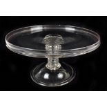 A George III glass tazza with raised rim and lobed ring turned central column to domed folded