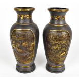 A pair of early 20th century Japanese bronzed vases with gilt highlights depicting landscape and
