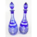 A pair of 20th century blue flash glass decanters, height 37cm (2).Additional InformationMinimal