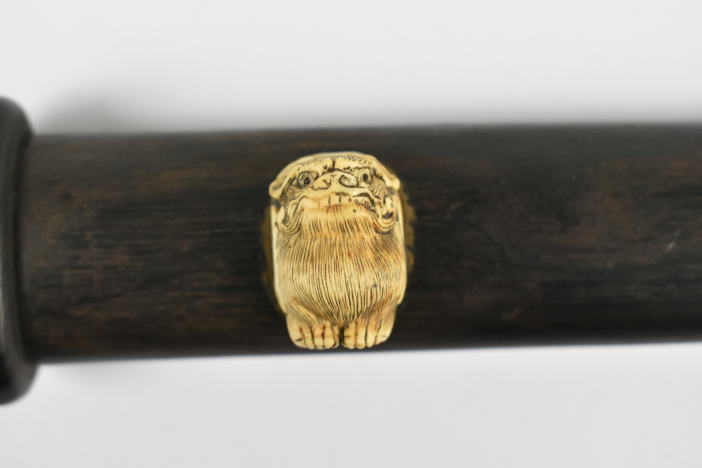 A good Japanese Meiji period hardwood doctor's accutchi with carved detail featuring ascetic monk, - Image 4 of 6